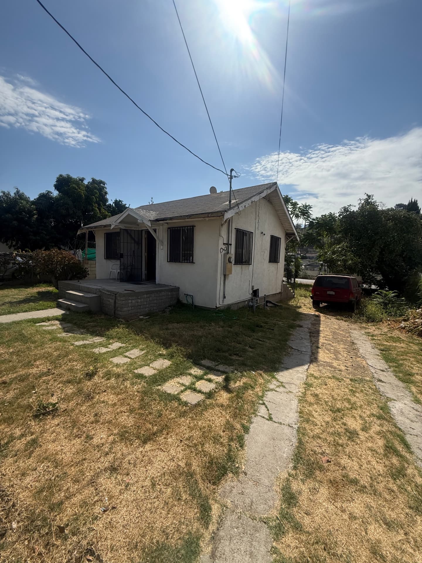 Full Exterior & Landscape Transformation — before