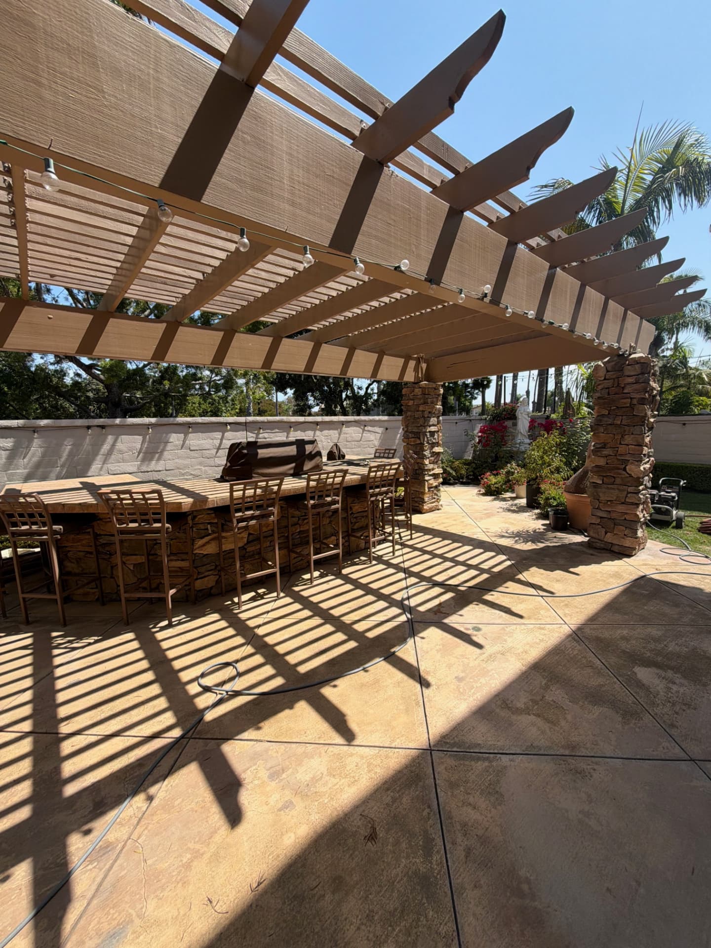 Stone Bar & Pergola Patio in California, USA by CHRETE Home & Construction